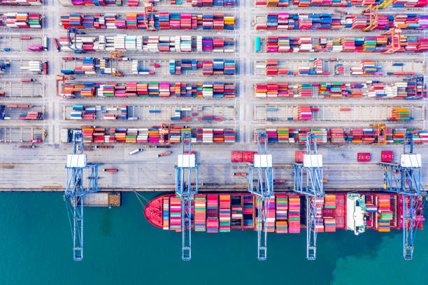 istock Top view of Deep water port with cargo ship and containers. It is an import and export cargo port where is a part of shipping dock and export products worldwide 1169071782