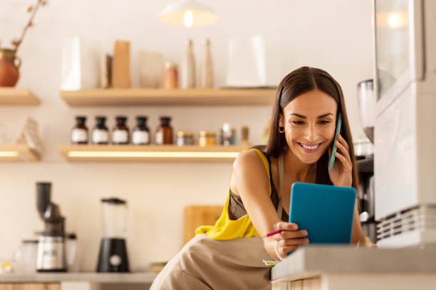 istock Woman looking at screen on tablet while ordering foods online 1169071913