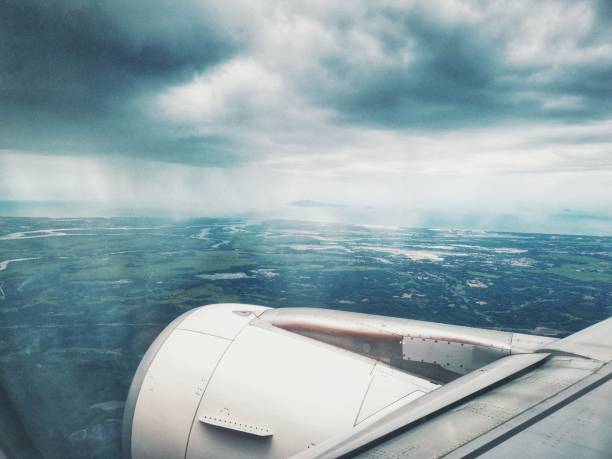 Plane landing at da nang,  Vietnam view from passenger window cloudy raining