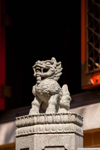 istock Small carved stone lion statue 1169074155