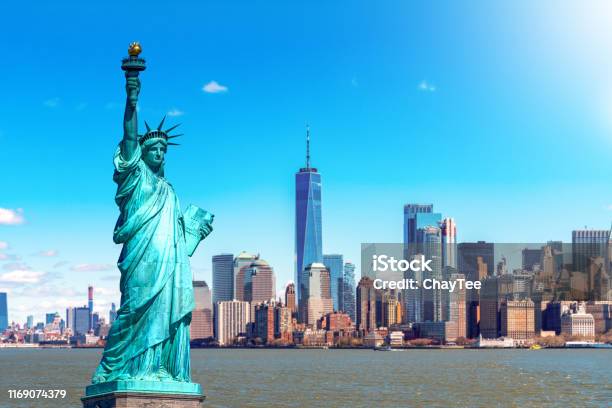 The Statue Of Liberty With The One World Trade Building Center Over Hudson River And New York Cityscape Background Landmarks Of Lower Manhattan New York City Architecture And Building Concept Stock Photo - Download Image Now