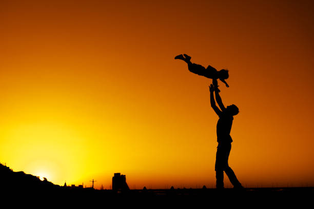istock Father and son playing on the town square 1169075506