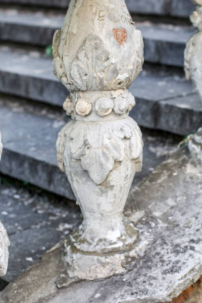 istock Columns on the old staircase. Railing on the stairs 1169076889