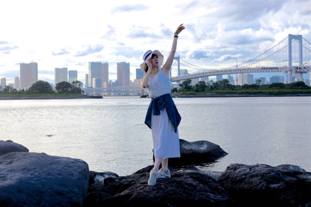 istock Young beautiful female dancing at coarst 1169076987