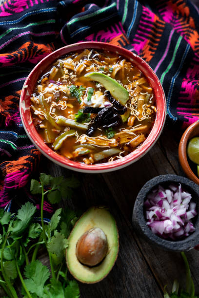 istock Mexican tortilla soup on colorful background 1169078077