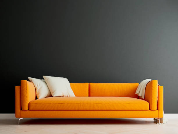 Black mock up wall with orange sofa in modern interior background, living room, Scandinavian style, 3D render, 3D illustration stock photo