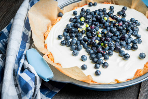 istock Fresh cheesecake with wild blueberries on the rustic background 1169082204