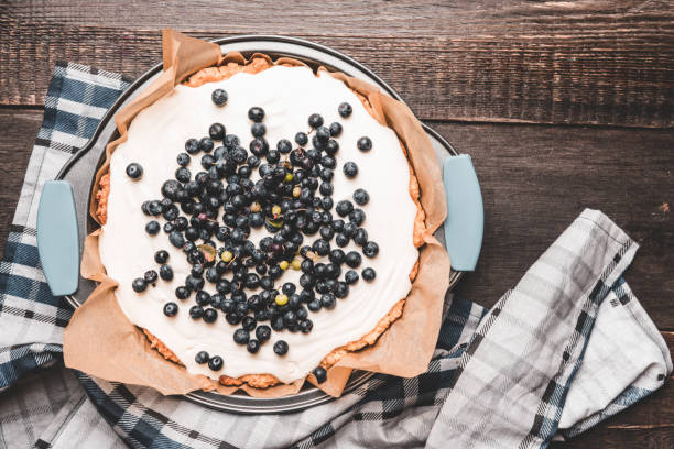 istock Fresh cheesecake with wild blueberries on the rustic background 1169082211