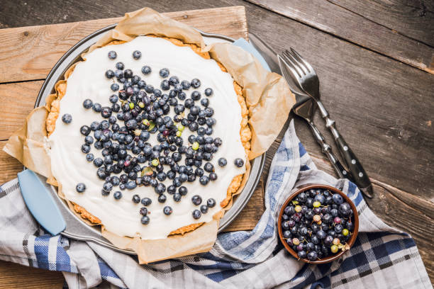 istock Fresh cheesecake with wild blueberries on the rustic background 1169082260
