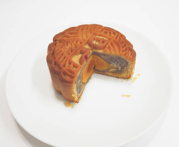 Chinese moon cake with salted duck egg inside isolated on white