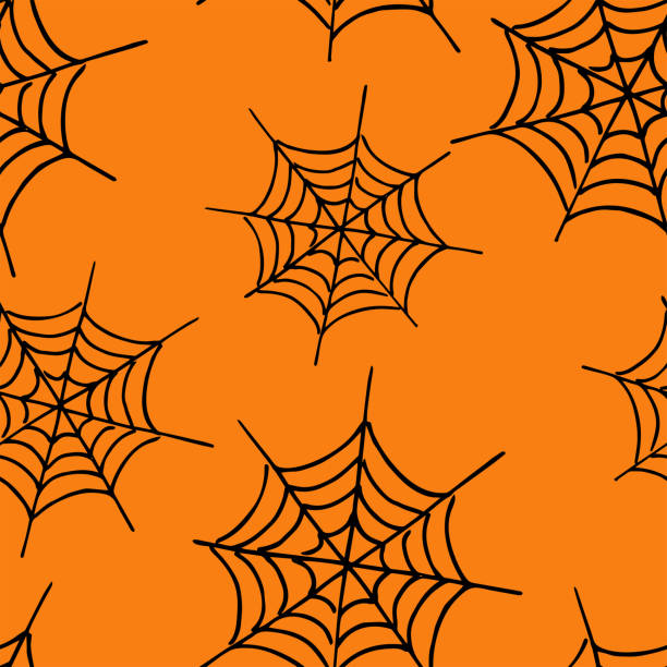 istock Festive halloween background. Spider web on an orange background. Halloween concept. 1169084528