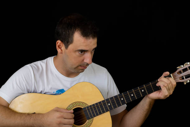 istock Man playing the guitar 1169085403