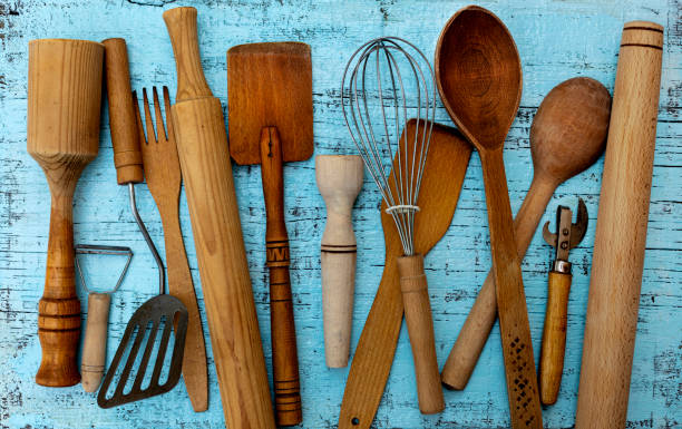 istock Vintage old kitchen utensils on a blue wooden background. 1169086183