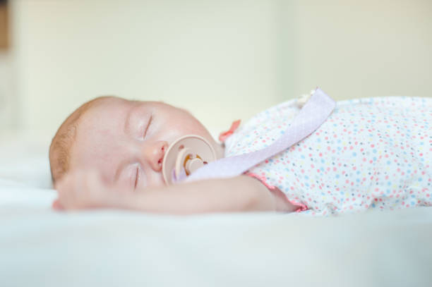istock Baby girl sleeping 1169087281