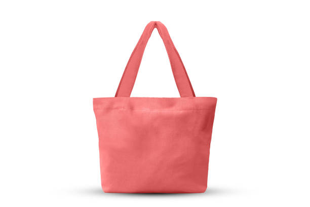 istock pink cloth shopping bag isolated on white background with clipping path 1169087598