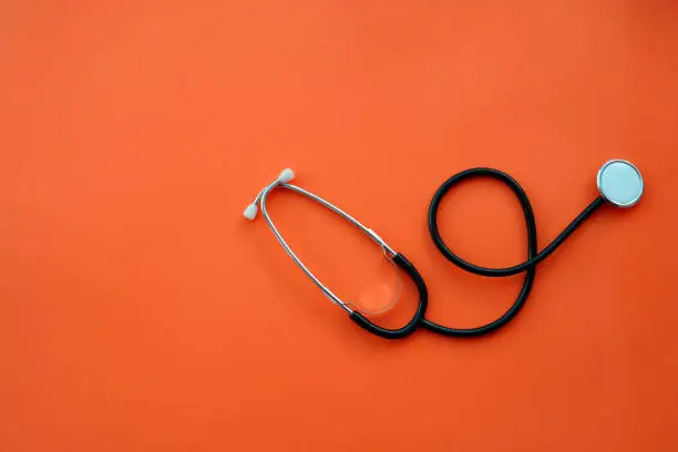 Photo of Stethoscope on color background