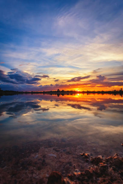 istock Sunset with reflection on the lake 1169090381