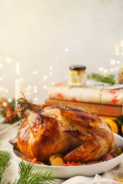 istock Christmas Roast Chicken with apples and thyme for a dinner. 1169091590