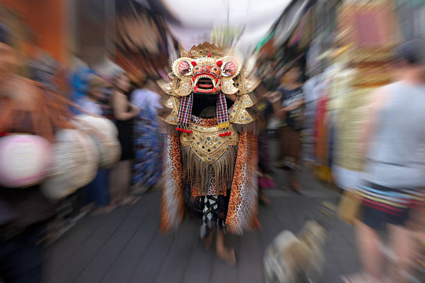Motion blur of a Barong Dance from the Balinese mythology in a street in Ubud Bali, Indonesia.