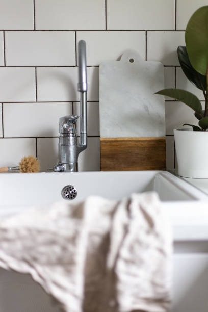 istock White Kitchen Farmhouse Sink. Home concept 1169096244