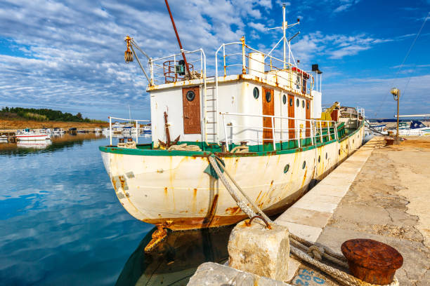 istock Old rusty ship docked in Privlaka port. 1169097348