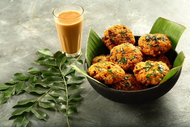 Spicy and hot parippu vada and Indian tea,