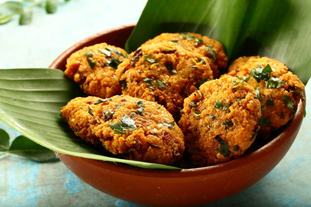 istock Bowl of vegan fried snack - parippu vada, 1169098670