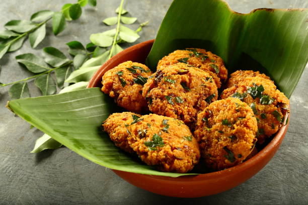 istock Bowl of vegan fried snack - parippu vada, 1169098724