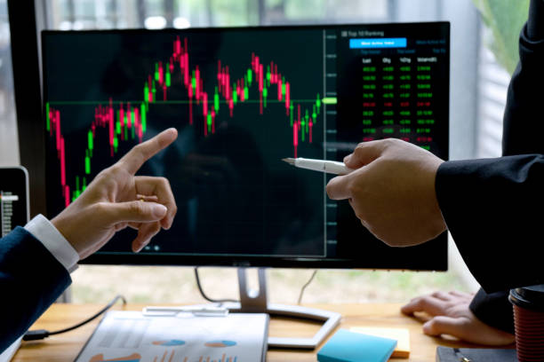 istock businessman sit at ther table looking at computer 1169098929