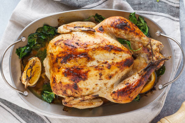 istock Festive celebration whole roasted turkey or chicken on a dish 1169098940