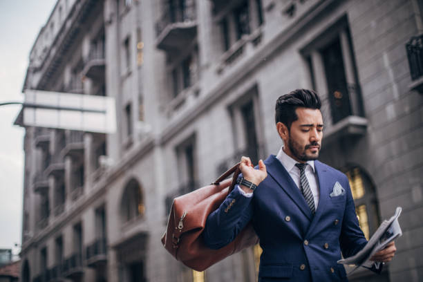 istock Handsome gentleman with bag on the street 1169099166