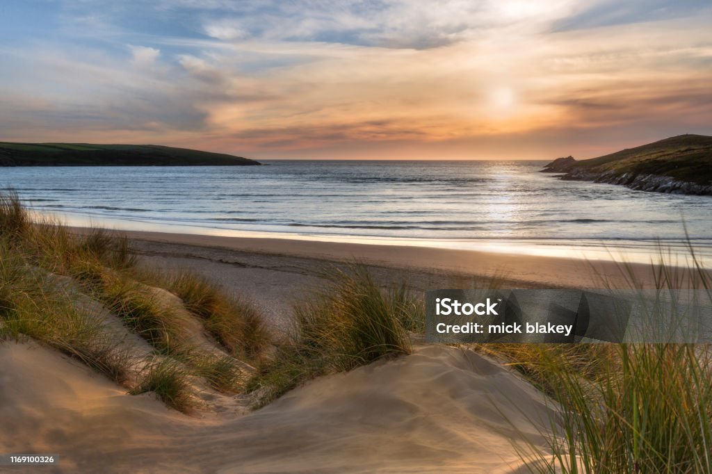 Sunlight over Dunes, Crantock Beach, on the beautiful north Cornwall coast. Beach Stock Photo