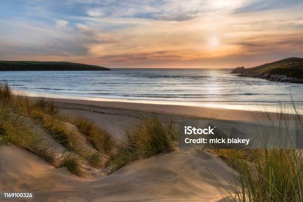 Sunlight Over Dunes Crantock Beach On The Beautiful North Cornwall Coast Stock Photo - Download Image Now