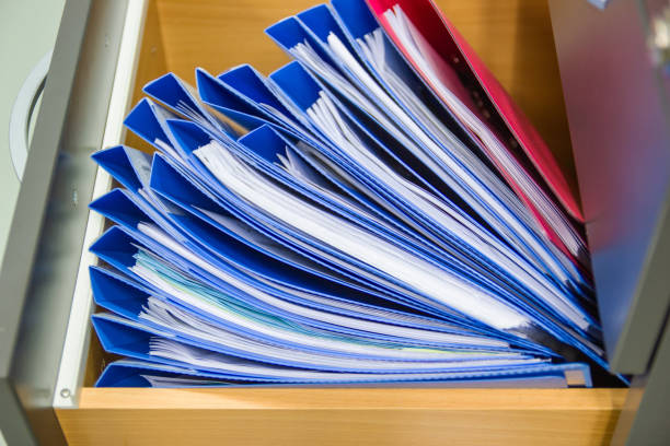 istock blue file folder documents In a file cabinet retention of contracts. 1169101334