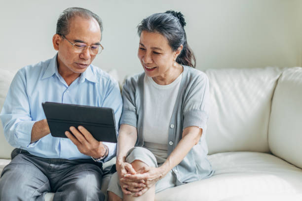 istock Modern senior couple using digital tablet together 1169101771
