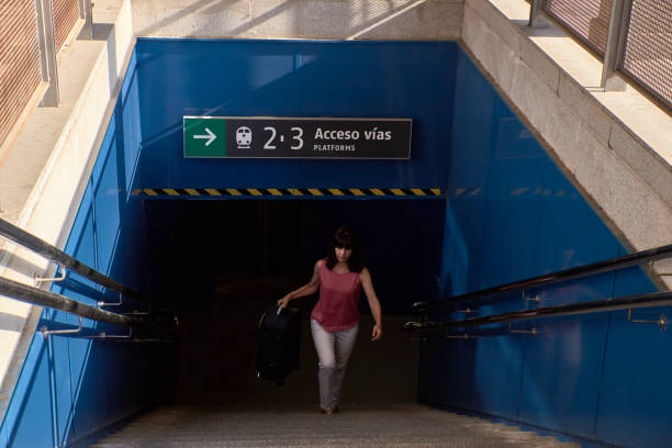istock woman walking in a train station 1169102486
