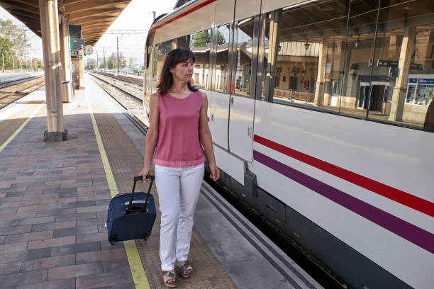 istock woman walking in a train station 1169102536