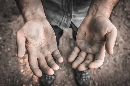 Dirty hands of a worker man after hard work