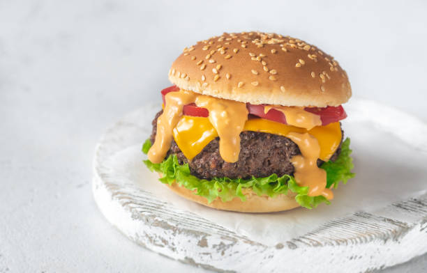 istock Hamburger on the wooden board 1169109170