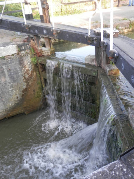 istock Water pouring from leaking lock gate on Grand Union canal 1169110956