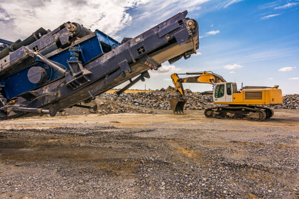 istock Stone crusher machine in a quarry or open-pit mine, to transform into gravel 1169113626