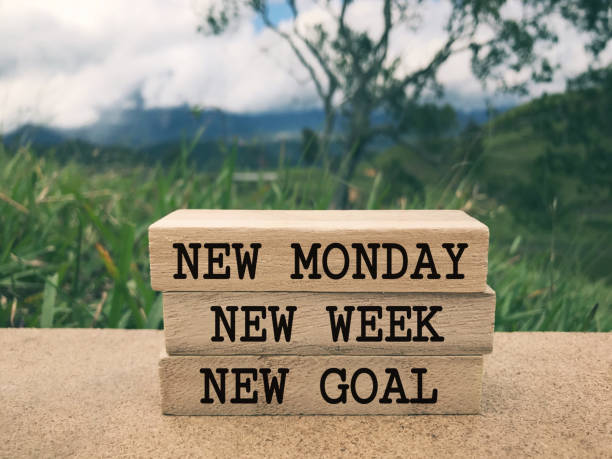 Motivational and inspirational wording. New Monday, New Week, New Goal written on wooden blocks. Blurred styled background. monday stock pictures, royalty-free photos & images