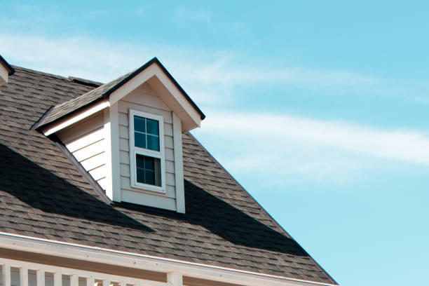 Authentic European house with roof and roof window. The close up image of authentic European house roof and roof window in blue sky with cloud. house residential structure roof rooftiles stock pictures, royalty-free photos & images