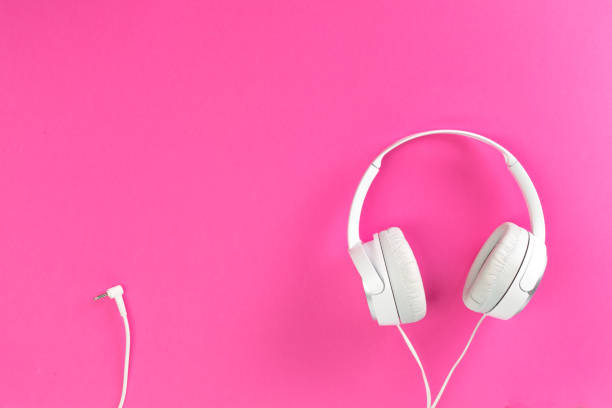 istock headphones on pink background 1169118982