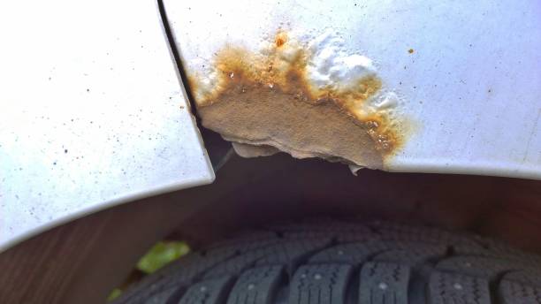 istock Car with rust, corrosion, defects and scratches, close up. How to remove surface rust from a vehicle. Concept of providing quality restoration parts. 1169124972