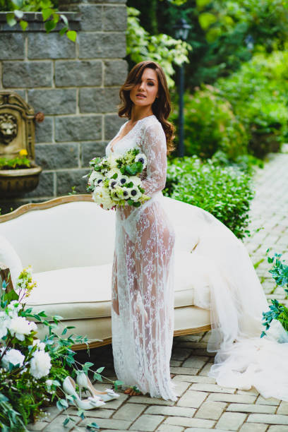 istock Young bride posing with bridal bouquet 1169126260