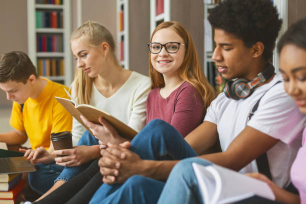 istock International classmates preparing for exams at library 1169126303