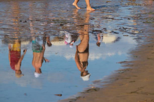 Bibione, (VE), Italy - August 16, 2019:Tourists sunbathe and walking in the beach of Bibione on the Adriatic Sea