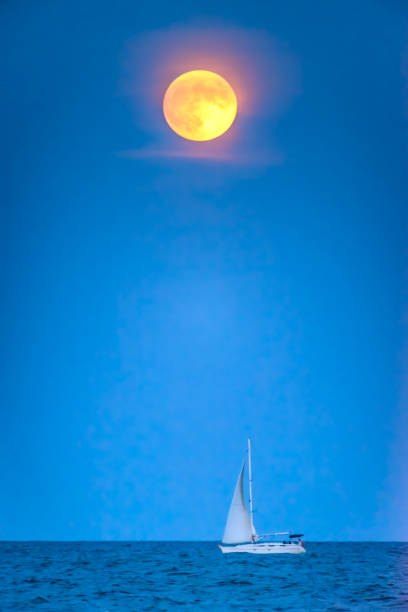 istock Full moon rising over a Yacht 1169127726