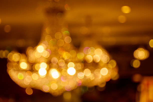 istock Blurred bokeh yellow light of chandelier 1169127893